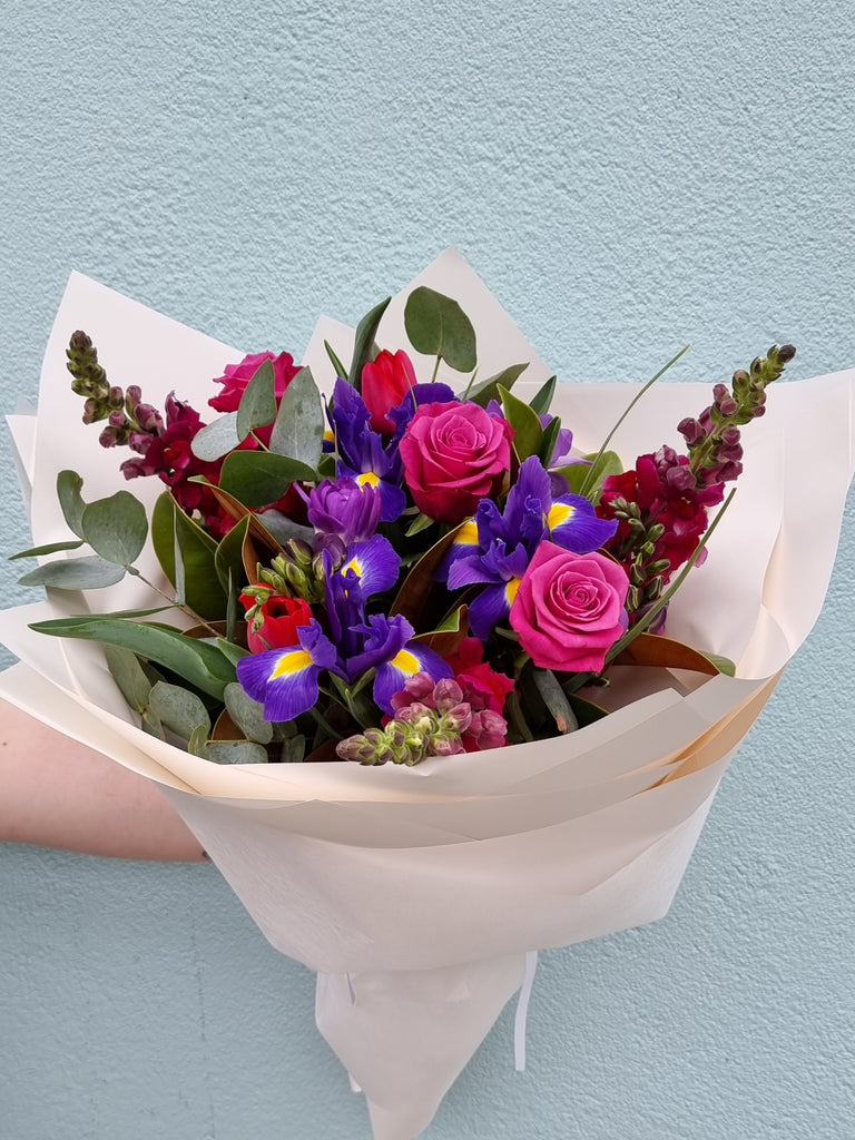 A stunning mix of purple's ,mauve's and deep pinks made from our seasonal range of fresh flowers.