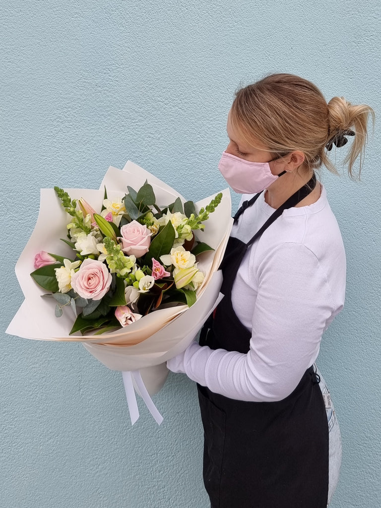 This Bouquet is a beautiful, delicate seasonal mix of soft pinks and whites, beautifully wrapped in the style of your choice, sent with a gift card containing your own personal message, and wet wrapped on the stems’ ends to ensure freshness. Florist , Florist Kilbirnie , Wellington Florist , Lyall Bay Florist