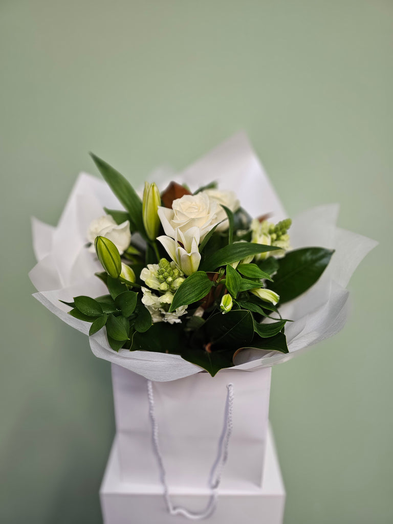 A bunch of classic whites and green flowers sent by  florist Wellington