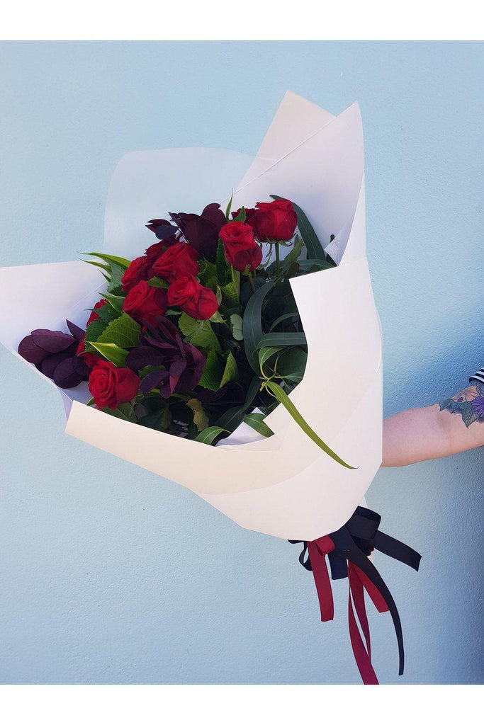 This Bouquet is made from 12 long steamed Red Roses, arranged with a lush mix of foliage,  beautifully wrapped, sent with a gift card containing your own personal message, and wet wrapped on the stems’ ends to ensure freshness.