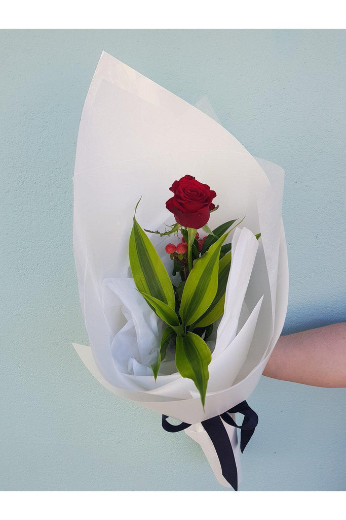 The Perfect gift for the person you love, a single Rose with beautiful foliage and wrap. Sent with a gift card containing your own personal message, and wet wrapped on the stems’ ends to ensure freshness