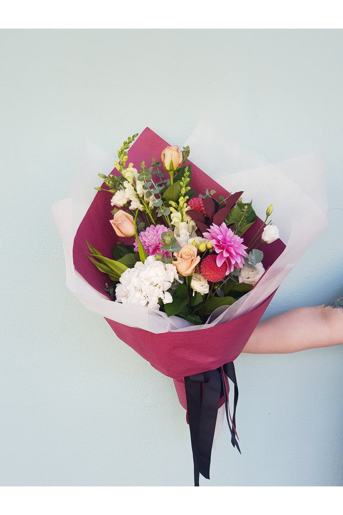 Sweetheart is A beautiful, seasonal mix with a few roses designed at our Kilbirnie Florist Shop