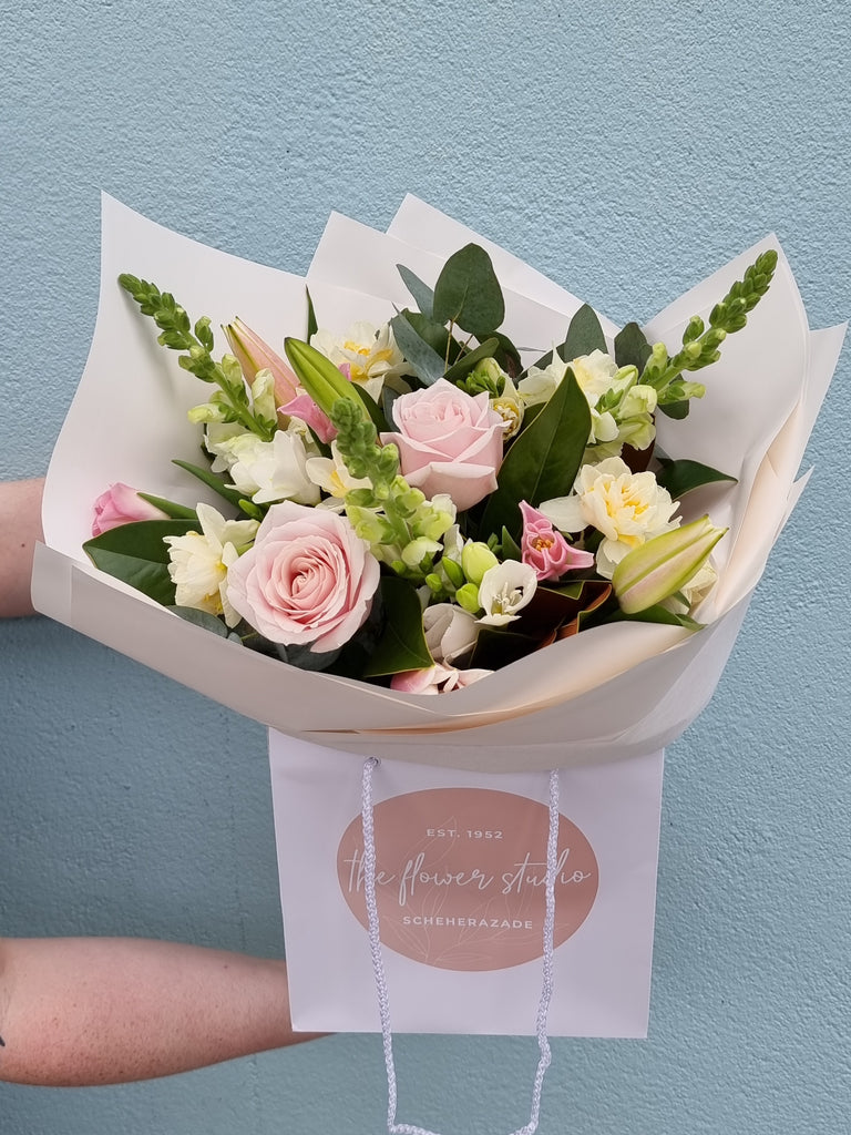This Bouquet is a beautiful, delicate seasonal mix of soft pinks and whites, beautifully wrapped in the style of your choice, sent with a gift card containing your own personal message, and wet wrapped on the stems’ ends to ensure freshness. Florist , Florist Kilbirnie , Wellington Florist , Lyall Bay Florist
